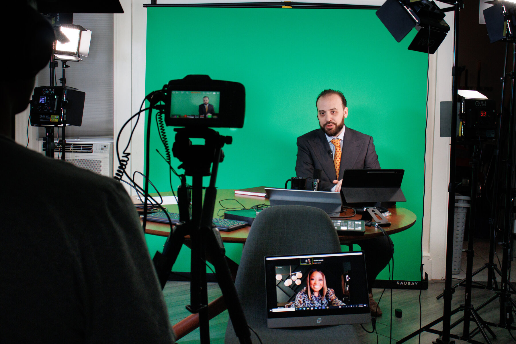 Dr. Vincent W. Allen, DPS — on the green-screen broadcast set hosting an interview with Star Jones (visible on the Zoom monitor in the foreground)